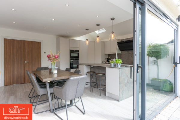 air-lift-and-slide-aluminium-doors-open-looking-into-kitchen