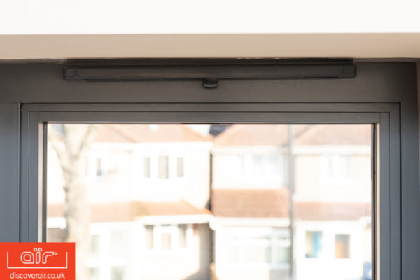 Flush-frame-aluminium-windows-in-dark-grey-close-up-of-air-vents