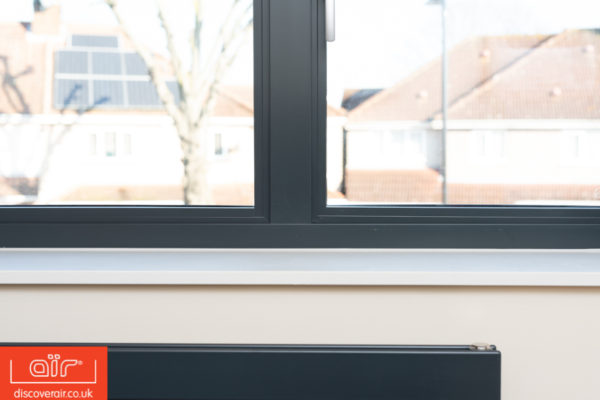 Flush-frame-aluminium-windows-in-dark-grey-close-up-of-joints