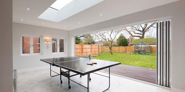 Recreation room with bi fold door system Recreation room with bi fold door system